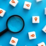 how to do local seo - magnifying glass with red location pins